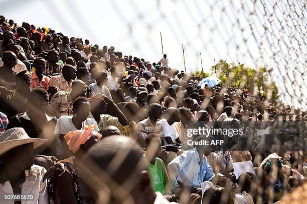 Sudanese attend the final of Sudan's first commercial wrestling league between the Mundari tribe from Central Equatoria and the Dinka from Bor at a...