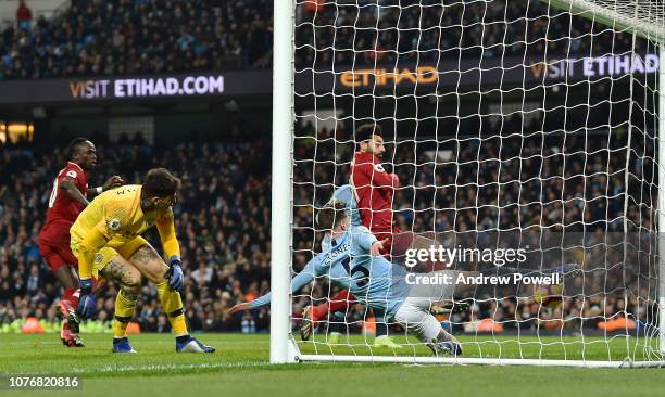 Mohamed Salah of Liverpool with John Stones of Manchester City during the Premier League match between Manchester City and Liverpool FC at Etihad...