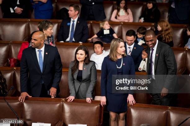 Freshman Reps. From left, Colin Allred, D-Texas, Abby Finkenauer, D-Iowa, Katie Hill, D-Calif., and Antonio Delgado, D-N.Y., talk on the House floor...