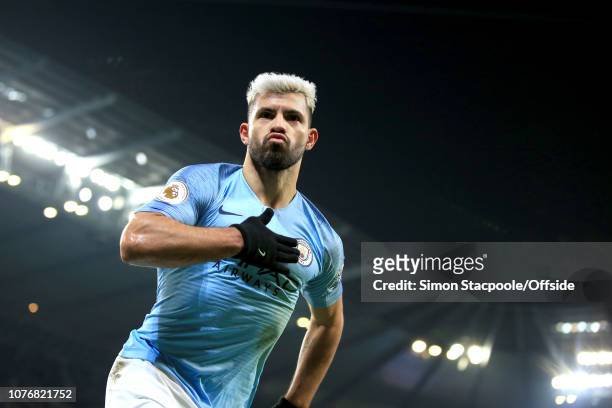Sergio Aguero of Man City celebrates scoring the opening goal during the Premier League match between Manchester City and Liverpool FC at the Etihad...