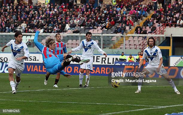 Maxi Lopez of Catania scores the opening goal of the Serie A match between Catania and Brescia at Stadio Angelo Massimino on December 19, 2010 in...