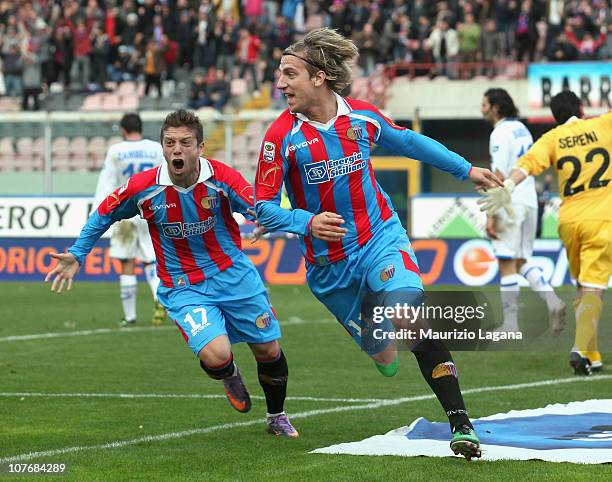 Maxi Lopez of Catania celebrates with team-mate Alejandro Gomez afer scoring the opening goal of the Serie A match between Catania and Brescia at...