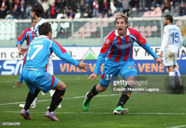 Maxi Lopez of Catania celebrates his opening goal with team-mate Alejandro Gomez during the Serie A match between Catania and Brescia at Stadio...