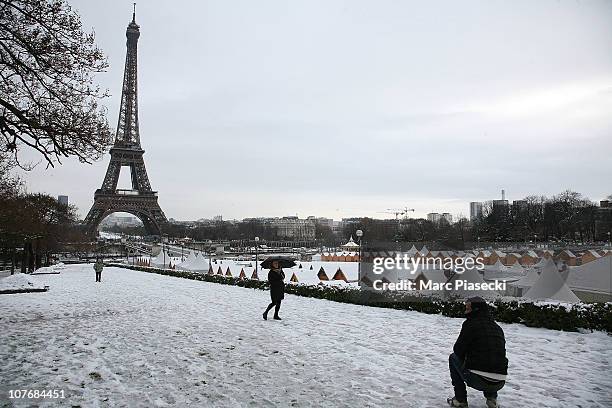 The Eiffel tower is seen as heavy snow hits Paris on December 19, 2010 in Paris, France. Heavy snowfall is causing chaos in UK and around Europe. In...