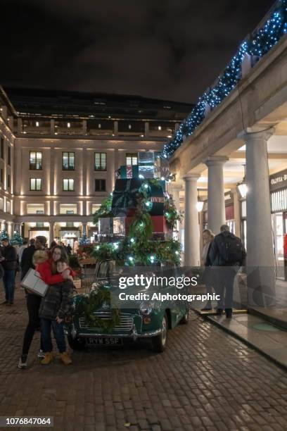 morris minor with christmas presents in covent garden market - travels with my father photocall stock pictures, royalty-free photos & images