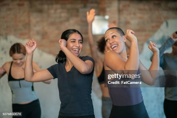 dancing together - aerobic stock pictures, royalty-free photos & images