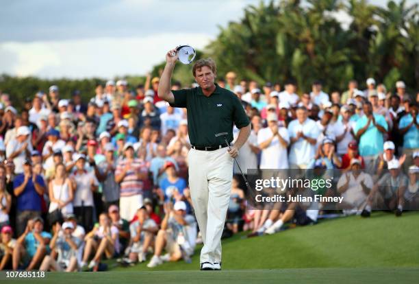 Ernie Els of South Africa celebrates after his final putt on the 18th green to win during round four of the South African Open Golf Championship at...