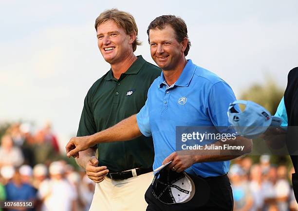 Ernie Els of South Africa is congratulated by Retief Goosen of South Africa after the final round during the South African Open Golf Championship at...