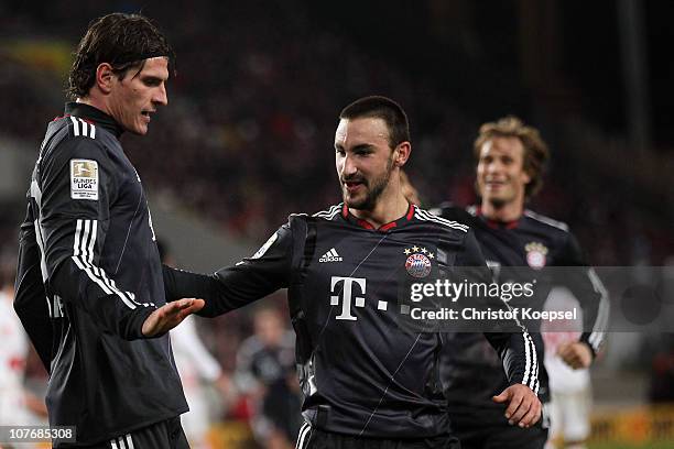 Mario Gomez of Bayern celebrates the first goal with Diego Contento of Bayern during the Bundesliga match between VfB Stuttgart and FC Bayern...