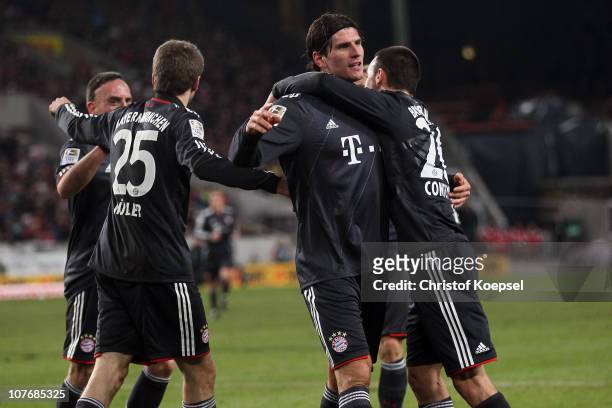 Mario Gomez of Bayern celebrates the first goal with Diego Contento of Bayern during the Bundesliga match between VfB Stuttgart and FC Bayern...