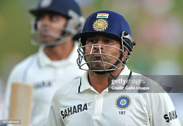 Sachin Tendulkar of India walks off after his unbeaten 50th Test century during day 4 of the 1st Test match between South Africa and India at...