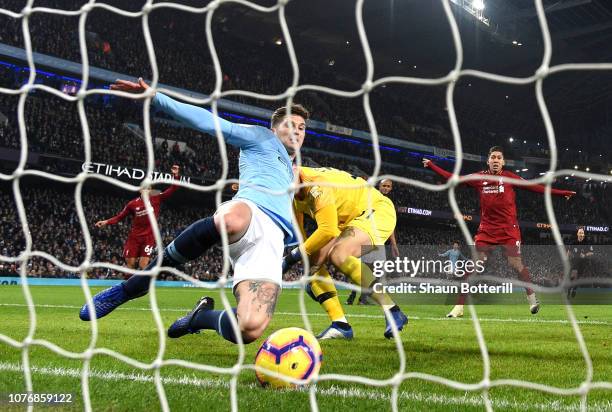 John Stones of Manchester City makes a goal line clearance during the Premier League match between Manchester City and Liverpool FC at the Etihad...