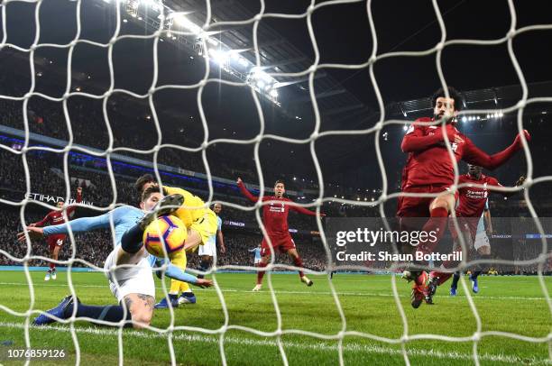 John Stones of Manchester City makes a goal line clearance during the Premier League match between Manchester City and Liverpool FC at the Etihad...