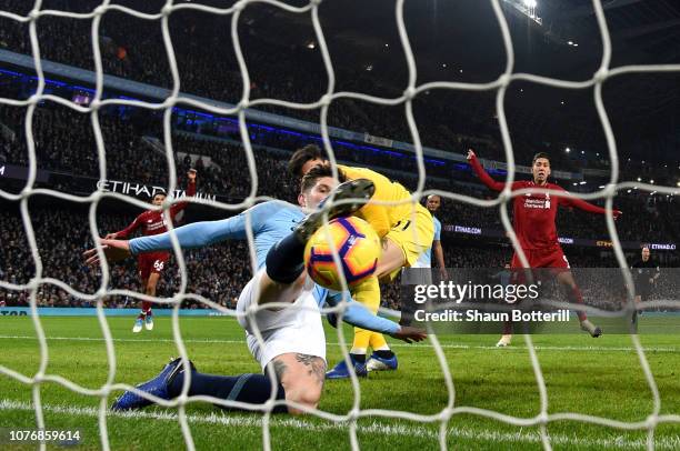 John Stones of Manchester City makes a goal line clearance during the Premier League match between Manchester City and Liverpool FC at the Etihad...