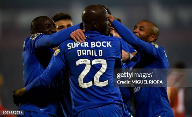 Porto's Portuguese midfielder Danilo Pereira celebrates with teammates after scoring a goal during the Portuguese League football match between CD...