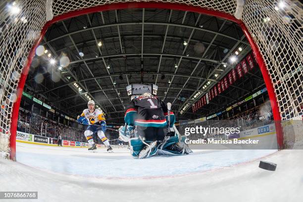 Dawson Davidson of the Saskatoon Blades scores the overtime winning goal on James Porter of the Kelowna Rockets at Prospera Place on December 1, 2018...