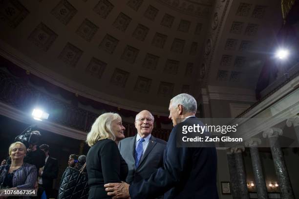 Sen. Patrick Leahy and his wife, Marcelle Pomerleau, speak to Vice President Mike Pence during a mock swearing in ceremony for members of the U.S....