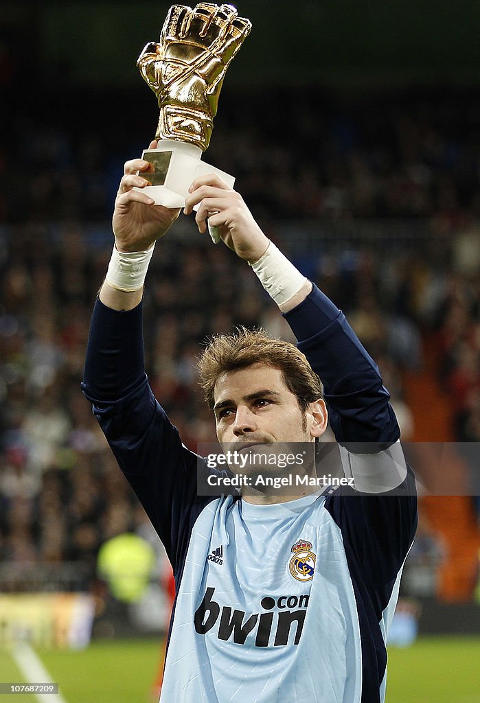 Iker Casillas Of Real Madrid Shows The Trophy Of Golden Glove Award iker-casillas-of-real-madrid-shows-the-trophy-of-golden-glove-award