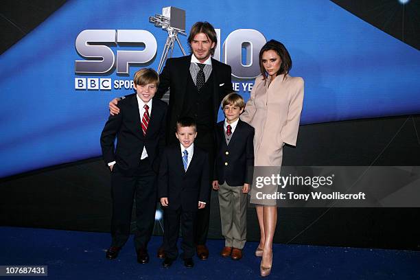 David Beckham and Victoria Beckham arrive with their children Brooklyn, Cruz and Romeo at the BBC Sports Personality Of The Year 2010 Awards at the...