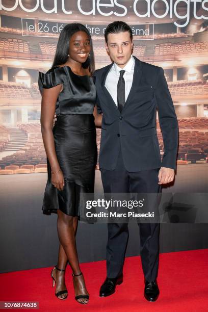 Actors Karidja Toure and Jules Benchetrit attend the 'Au bout des doigts' Premiere at UGC Cine Cite Bercy on December 03, 2018 in Paris, France.