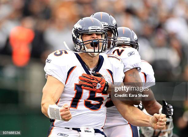 Tim Tebow of the Denver Broncos celebrates after he ran in for a touchdown against the Oakland Raiders at Oakland-Alameda County Coliseum on December...