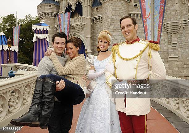 In this handout image provided by Disney, to celebrate their first wedding anniversary, Kevin Jonas of the pop trio "Jonas Brothers" and his wife...