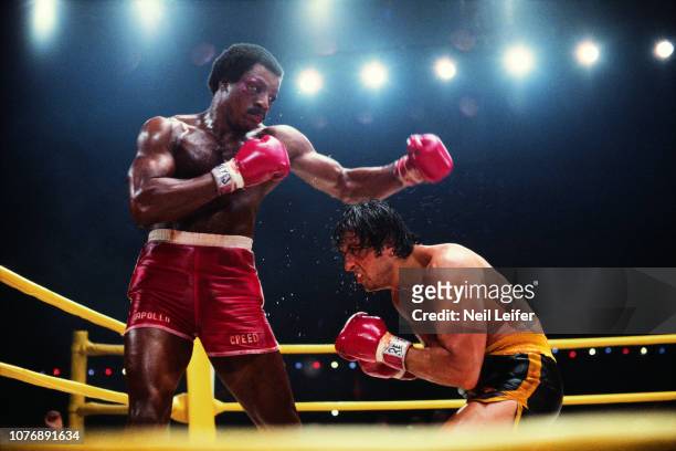 Carl Weathers , as Apollo Creed, in action vs Sylvester Stallone , as Rocky Balboa, during fight sequence in filming on the set of "Rocky II" movie....