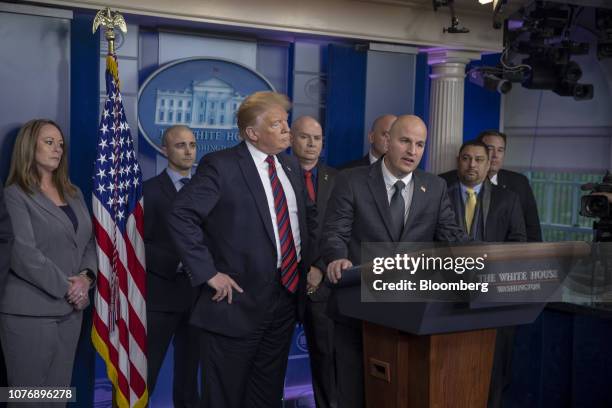 Brandon Judd, president of the National Border Patrol Council, speaks while U.S. President Donald Trump listens during a White House press briefing...