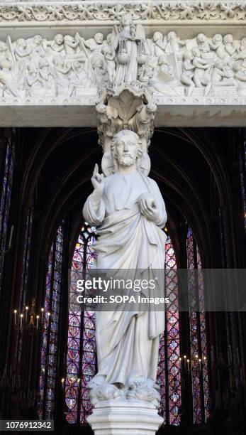 Sculpture seen at the Sainte Chapelle is a royal chapel in the Gothic style, within the medieval Palais de la Cité on the Île de la Cité at the River...