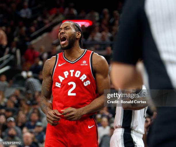 Kawhi Leonard of the Toronto Raptors celebrates after he scored his fist basket against the San Antonio Spurs at AT&T Center on January 3, 2019 in...