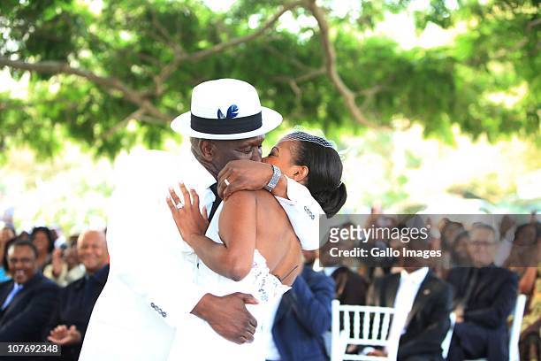 South African National Police Commissioner Bheki Cele kisses his new wife, Thembeka Ngcobo, at their wedding, held at the elite Lynton Hall Estate on...