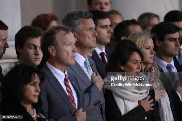 Marvin Bush , son of former U.S. President George H. W. Bush, and members of his family watch as a U.S. Military honor guard carries the casket of...