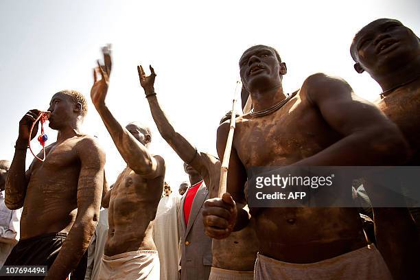 Members of the Mundari tribe from Central Equatoria attend the final of Sudan's first commercial wrestling league between their tribe and the Dinka...