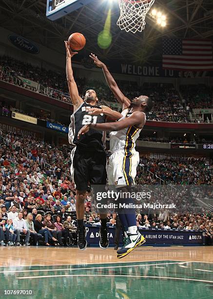 Tim Duncan of the San Antonio Spurs goes to the net against Francisco Elson of the Utah Jazz during a game at EnergySolutions Arena on November 19,...