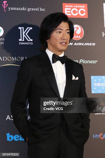 Japanese actor Takuya Kimura poses backstage during the Asia Fashion Award 2018 at Chiang Kai-sheak Memorial Hall on December 1, 2018 in Taipei,...