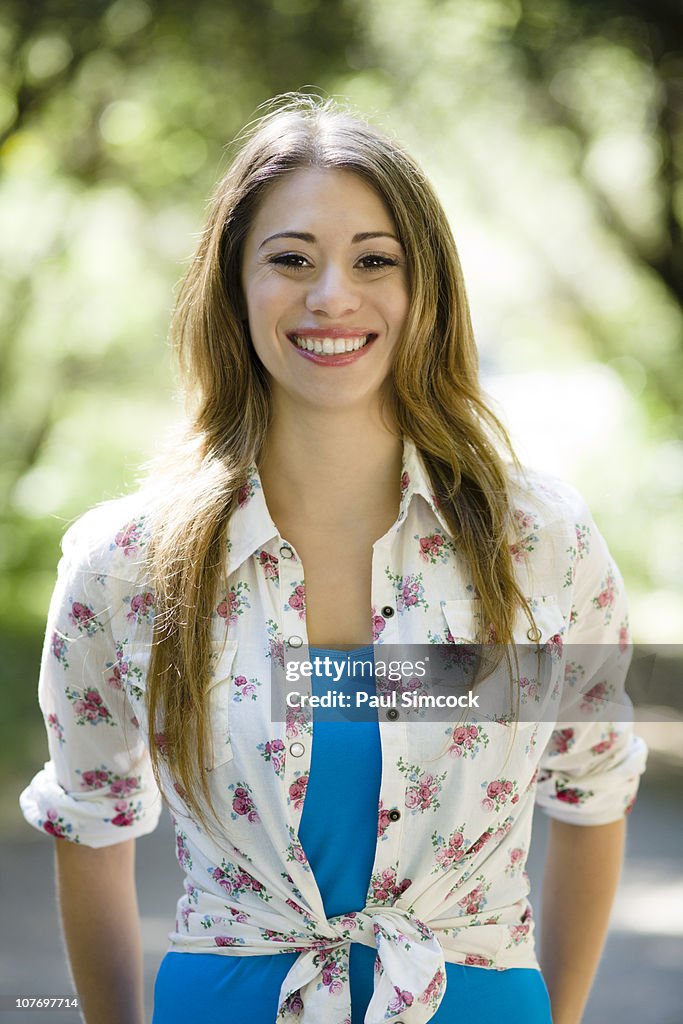 Smiling Hispanic woman outdoors