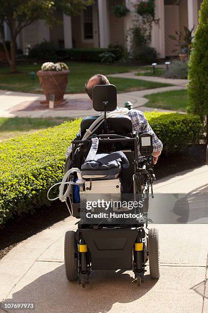 man with duchenne muscular dystrophy in a motorized wheelchair - duchenne muscular dystrophy bildbanksfoton och bilder