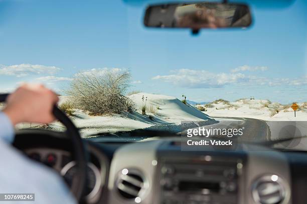usa, new mexico, white sands national monument, businessman using binoculars on rock - white sand dune stock pictures, royalty-free photos & images