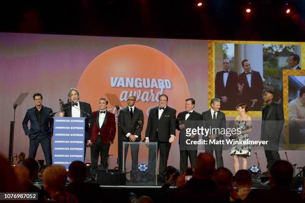 Peter Farrelly accepts the Vanguard Award from Jim Carrey with Mike Hatton, Kwame Parker, Nick Vallelonga, Brian Currie, Viggo Mortensen, Linda...