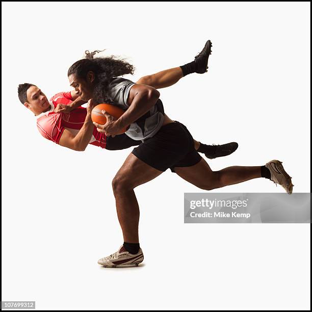 rugby players tackling for ball - rugby tackling stock pictures, royalty-free photos & images