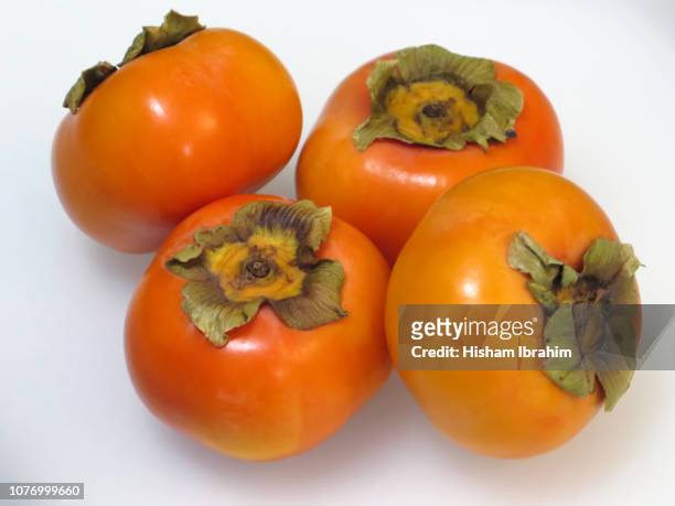 fresh japanese fuyu persimmon fruit. - amerikanische kakipflaume stock-fotos und bilder