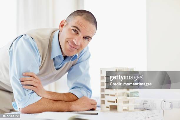 south africa, portrait of architect with apartment model - shaved head stock pictures, royalty-free photos & images