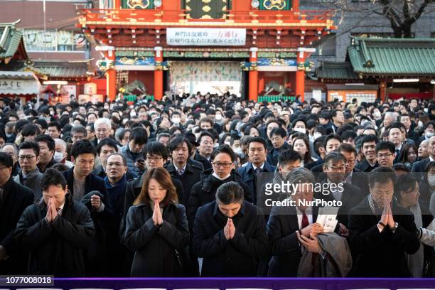 People offer prayers on the first business day of the year at the Kanda Myojin shrine, which is known to be frequented by worshippers seeking good...