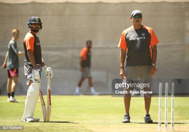 Virat Kohli of India and Ravi Shastri, Head Coach of India, look on during an India training session at Adelaide Oval on December 04, 2018 in...