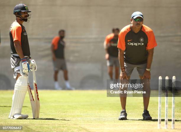 Virat Kohli of India and Ravi Shastri, Head Coach of India, look on during an India training session at Adelaide Oval on December 04, 2018 in...