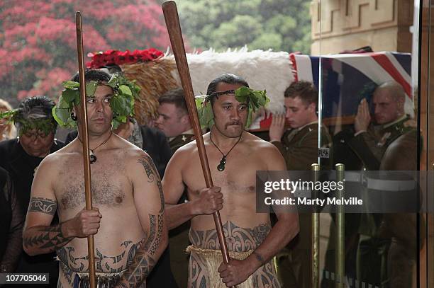 Army paratroopers carry the casket of Private Howard with a Maori Warrior escort at the Wellington Cathedral on December 21, 2010 in Wellington, New...