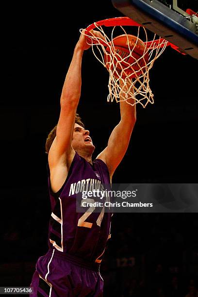 John Shurna of the Northwestern Wildcats dunks against the St. Francis Terriers during the Madison Square Garden Holiday Festival at Madison Square...