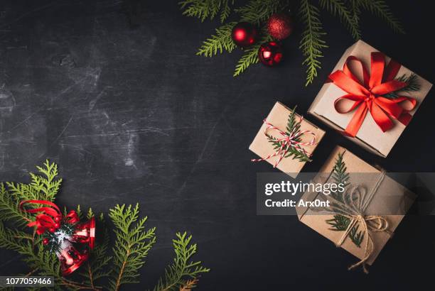 christmas craft gift boxes on black background - christmas copy space stock pictures, royalty-free photos & images