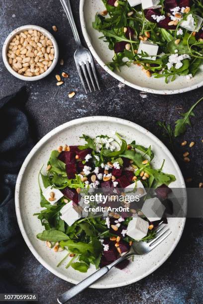 roasted beet and feta salad with arugula - greek food stock pictures, royalty-free photos & images