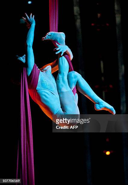 Actors perform during Quidam in December 20, 2010 in Montreal, Canada. The productio, which premiered in Montreal under the Big Top in 1996, is being...